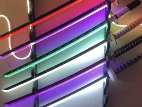 LED sword from Demon Slayer with colorful lighting and a wall mount, perfect for anime-themed decoration.