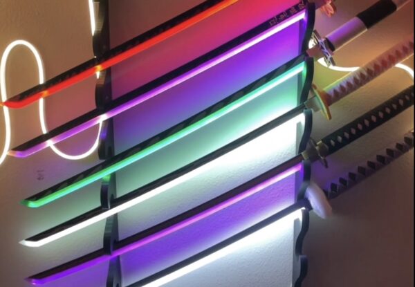 LED sword from Demon Slayer with colorful lighting and a wall mount, perfect for anime-themed decoration.